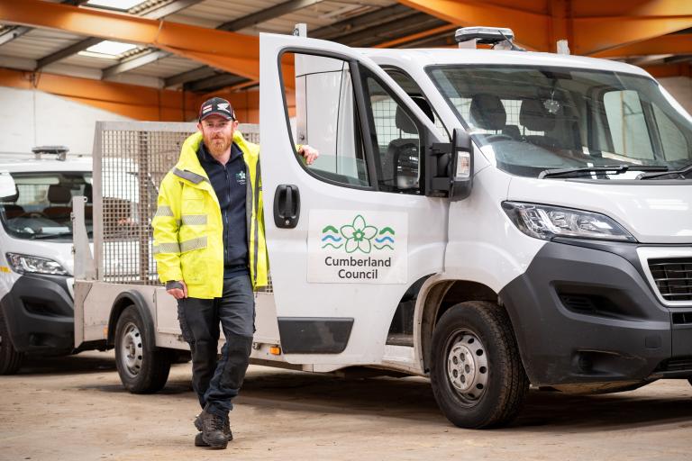 cumberland council staff member with council vehicle. cumberland council logo on vehicle door