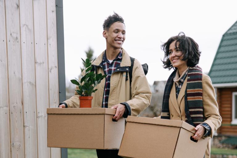 Couple moving with boxes